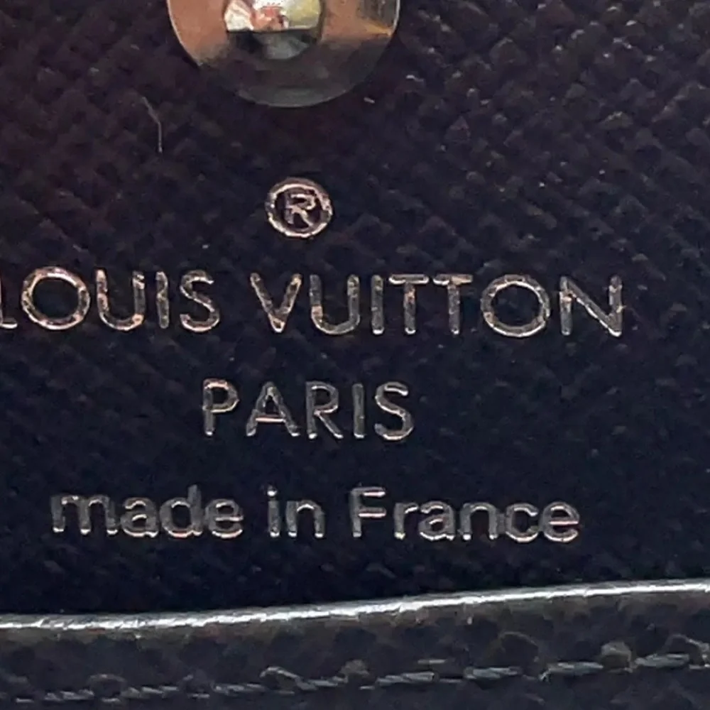 LOUIS VUITTON Black Taiga Porte Monnaie Boite COMES WITH: LV BOX, DUST BAG